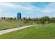Manicured Ditch Trail with a smooth paved path through the community at 12942 Leyden St, Thornton, CO 80602