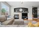 Comfortable Gathering room boasting a fireplace, hardwood floors, and natural light at 12942 Leyden St, Thornton, CO 80602