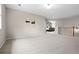 Open and airy living room with neutral walls, offering views into the bedroom and a comfortable space at 12942 Leyden St, Thornton, CO 80602