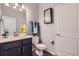 Stylish bathroom featuring modern fixtures, a vanity with storage, and decorative accents at 7933 Florado St, Denver, CO 80221