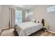Charming bedroom with a comfortable bed, soft color palette, and bright natural light at 7933 Florado St, Denver, CO 80221