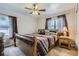 Inviting bedroom featuring a comfortable bed, classic furnishings, and a relaxing ambiance at 7933 Florado St, Denver, CO 80221