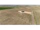 Expansive aerial shot of the property showcasing its secluded location and vast surrounding fields at 65960 E Evans Pl, Byers, CO 80103