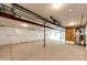 Unfinished basement with concrete floors, exposed pipes, and insulated walls, ready to be customized at 65960 E Evans Pl, Byers, CO 80103