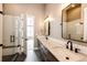Beautiful bathroom with double vanity, granite countertops, undermount sinks and glass shower at 65960 E Evans Pl, Byers, CO 80103