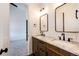 Stylish bathroom featuring double vanity, granite countertops, undermount sinks and modern fixtures at 65960 E Evans Pl, Byers, CO 80103