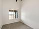 Bedroom with carpet and a window looking out onto a green space at 65960 E Evans Pl, Byers, CO 80103
