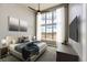 This stylish main bedroom features a large window and a ceiling fan at 65960 E Evans Pl, Byers, CO 80103