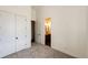 Carpeted bedroom featuring closet and ensuite bathroom at 65960 E Evans Pl, Byers, CO 80103