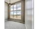 The bedroom features large windows with scenic views and a ceiling fan at 65960 E Evans Pl, Byers, CO 80103