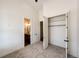 Bright bedroom featuring closet and ensuite bathroom at 65960 E Evans Pl, Byers, CO 80103