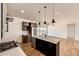This spacious kitchen features stainless appliances and a large island at 65960 E Evans Pl, Byers, CO 80103