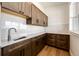 This kitchen features granite countertops, tile backsplash, and plentiful cabinet space at 65960 E Evans Pl, Byers, CO 80103