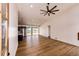 Open concept living space with eat in kitchen, dining area, tall ceilings, and sliding glass door at 65960 E Evans Pl, Byers, CO 80103