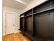 Mudroom featuring custom coat racks and bench at 65960 E Evans Pl, Byers, CO 80103