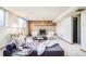 Comfortable basement living room with modern furniture and a cozy fireplace at 85 S Flower St, Lakewood, CO 80226