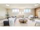Bright and airy basement living space with comfortable seating and natural light at 85 S Flower St, Lakewood, CO 80226