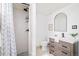 Stylish bathroom with modern vanity, tiled shower, and sleek fixtures at 85 S Flower St, Lakewood, CO 80226