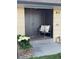 Inviting front entry with a bench and charming flower planter adding curb appeal to this home at 85 S Flower St, Lakewood, CO 80226