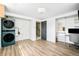 Open laundry room with modern washer and dryer, desk and great storage at 85 S Flower St, Lakewood, CO 80226