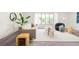 Bright living room with modern furniture, large rug, and natural light from the windows at 85 S Flower St, Lakewood, CO 80226
