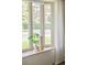 Inviting window seat with sheer curtains and a peaceful view of the outdoors at 85 S Flower St, Lakewood, CO 80226