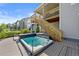 Backyard featuring a hot tub on the wooden deck at 7166 S Vandriver Way, Aurora, CO 80016