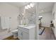 Bathroom featuring a shower, vanity, and view into the adjacent room at 7166 S Vandriver Way, Aurora, CO 80016