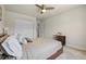 Inviting bedroom featuring a ceiling fan, closet and a calming color scheme, creating a serene and relaxing retreat at 7166 S Vandriver Way, Aurora, CO 80016