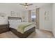 Bright bedroom featuring a ceiling fan, closet and large windows creating a comfortable and relaxing atmosphere at 7166 S Vandriver Way, Aurora, CO 80016