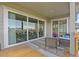 Covered outdoor deck with patio seating, featuring views of the surrounding neighborhood homes at 7166 S Vandriver Way, Aurora, CO 80016