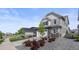 Well maintained two-story home with a two-car garage, complemented by a manicured front lawn at 7166 S Vandriver Way, Aurora, CO 80016