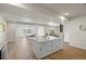 Large open living area with kitchen island, plank flooring, recessed lighting, and ample space for recreation at 7166 S Vandriver Way, Aurora, CO 80016