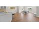 Spacious recreation room with a ping pong table, a breakfast bar and sleek laminate flooring at 7166 S Vandriver Way, Aurora, CO 80016
