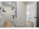 Organized walk-in closet with ample shelving and storage space leading to a well-appointed bathroom at 7166 S Vandriver Way, Aurora, CO 80016