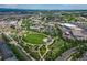 Expansive aerial view of the neighborhood showing the park, surrounding commercial areas, and community amenities at 1162 Rockhurst Dr # 404, Highlands Ranch, CO 80129