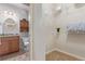 Bathroom and closet feature granite countertops and wire shelving at 1162 Rockhurst Dr # 404, Highlands Ranch, CO 80129