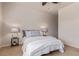 Neutral bedroom with ceiling fan and side tables at 1162 Rockhurst Dr # 404, Highlands Ranch, CO 80129