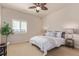 Neutral bedroom with ceiling fan, plantation shutters, and view at 1162 Rockhurst Dr # 404, Highlands Ranch, CO 80129