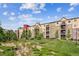 Attractive multi-story condo building with well-maintained landscaping and inviting outdoor spaces at 1162 Rockhurst Dr # 404, Highlands Ranch, CO 80129