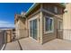 Exterior angle view of the property's corner featuring the balcony, windows, and siding at 1162 Rockhurst Dr # 404, Highlands Ranch, CO 80129