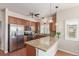 Well-lit kitchen featuring granite countertops, stainless steel appliances, and ample cabinet space at 1162 Rockhurst Dr # 404, Highlands Ranch, CO 80129