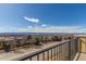 Expansive neighborhood view from the balcony, showcasing the landscape and clear skies at 1162 Rockhurst Dr # 404, Highlands Ranch, CO 80129