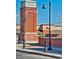 Exterior view of the Town Center area, highlighting brick architecture and streetscape elements at 1162 Rockhurst Dr # 404, Highlands Ranch, CO 80129