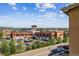 Scenic view showcasing a clock tower, surrounding buildings, and distant landscapes from the property at 1162 Rockhurst Dr # 404, Highlands Ranch, CO 80129