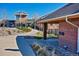 View of the Westridge Pool entry and surrounding landscaped area, emphasizing its welcoming atmosphere at 1162 Rockhurst Dr # 404, Highlands Ranch, CO 80129