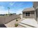 Backyard features a patio, rock landscaping, and neutral-toned fence creating a private outdoor space at 311 Josef Cir, Fort Lupton, CO 80621