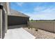 Backyard features a patio and rock landscaping with a neutral toned fence creating a private outdoor space at 311 Josef Cir, Fort Lupton, CO 80621