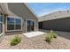 Backyard features a patio, rock landscaping, sliding glass doors and large windows for indoor-outdoor living at 311 Josef Cir, Fort Lupton, CO 80621