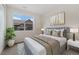 Comfortable bedroom with large window offering natural light and neutral tones, creating a serene space at 311 Josef Cir, Fort Lupton, CO 80621